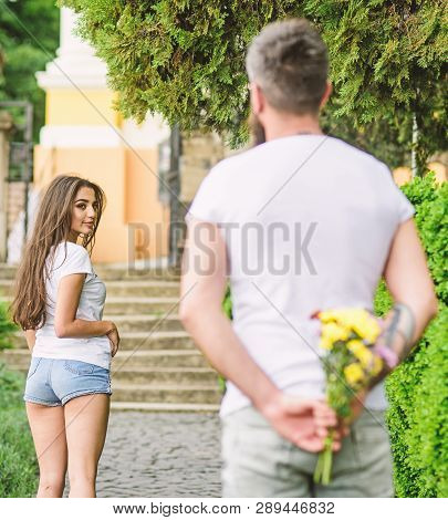 How To Pick Up Girl. Girl Looks At Man With Bouquet With Interest. Start Dating. Golden Rules For As