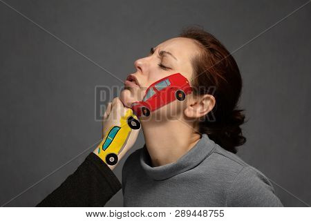 The Concept Of An Insured Event, A Car Accident.the Sudden Collision Of Cars, Painted On Parts Of Th