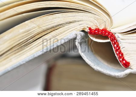 Opened Old Book In A Bright Cover Lies On The Table Close-up Design Blank For The Project