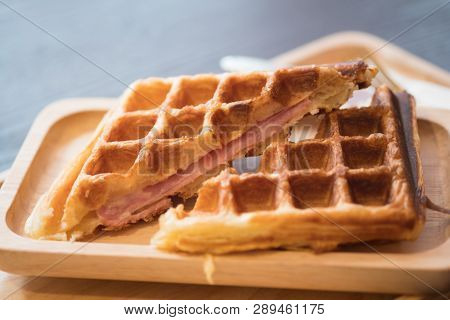Grilled Waffles With Bacon On Wooden Tray, Close Up