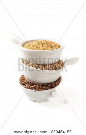 Healthy Food Ingredents 3 Kind Of Gluten Free Grains Flax, Amaranth And Sesame Seeds On White Backgr