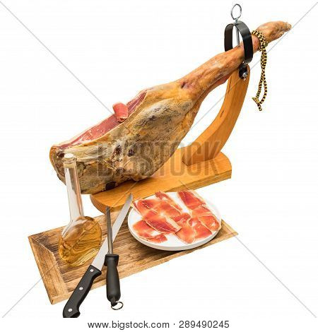 Spanish Serrano Ham On The Leg With Wood Holder - Isolated