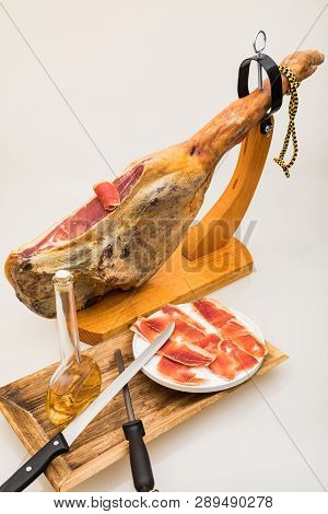 Spanish Serrano Ham On The Leg With Wood Holder - Isolated