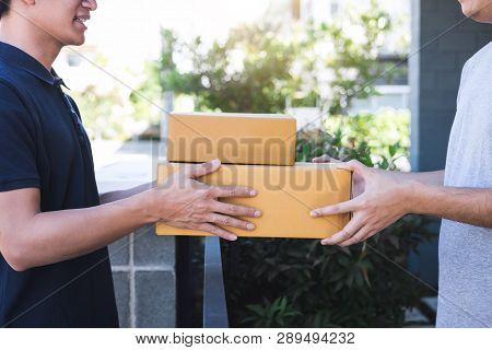 Delivery Mail Man Giving Parcel Box To Recipient, Young Owner Accepting Of Cardboard Boxes Package F