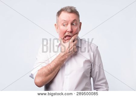 Sad Senior Man In White Shirt Thinking Abour Life.