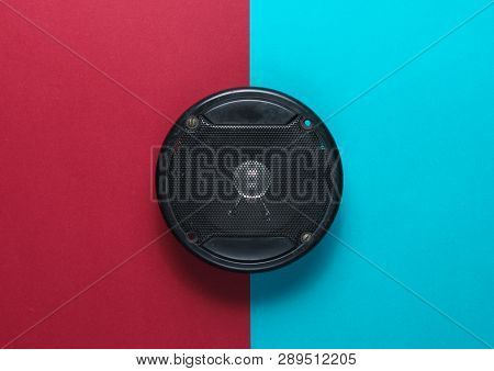 Audio Speaker On A Red-blue Background. Top View.