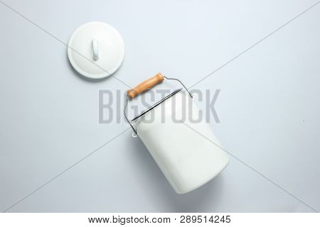 White Enameled Milk Can On A Gray Background. Top View