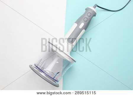 Electric Hand Blender Attached To Chopping Bowl On Blue White Background. Top View