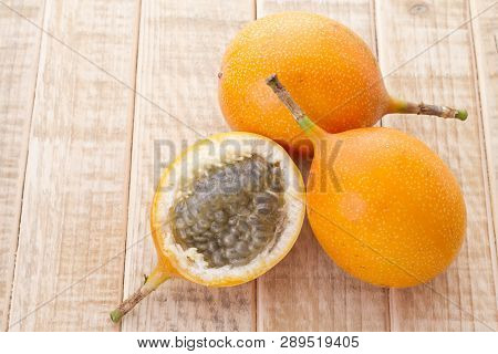 Passion Fruit Granadilla On The Table - Passiflora Ligularis