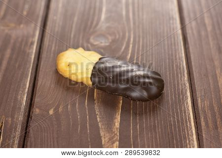 One Whole Lazy Cookie With Chocolate On Brown Wood