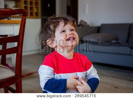 Little Todler Boy Stay At Kitchen In A Day And Watiching Something