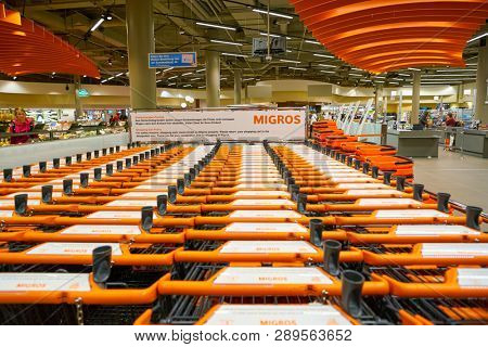 ZURICH, SWITZERLAND - CIRCA OCTOBER, 2018: trolleys at Migros supermarket in Zurich International Airport. Migros is Switzerland's largest retail company.