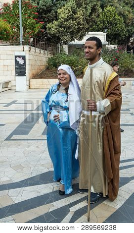 Nazareth, Israel, December 23, 2017 : A Married Couple - Husband And Pregnant Wife In The Clothes Of