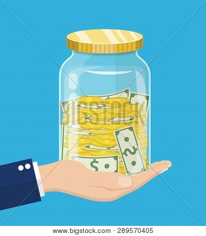 Hand Saver With Glass Jar And Coins Money. Money Jar. Saving Dollar Coin In Jar.save Your Money Conc