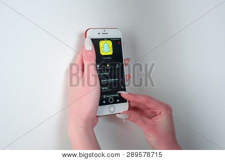Tula, Russia, March 12, 2019: Hands Holding Apple Iphone 8 Color With Snapchat App On The Screen. Sn