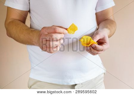 Processed Food, Unhealthy Diet, Imbalanced Ration. Overweight Man Eating Salted Fattening Potato Chi