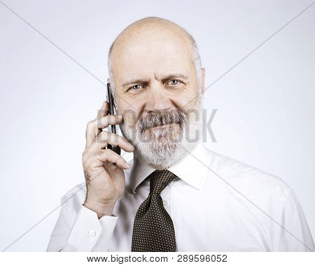 Happy Mature Man Calling With His Phone