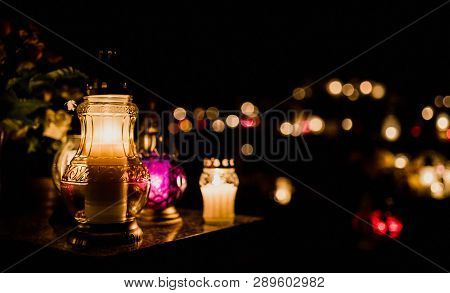 The Cemetery, Candles Burning In Lanterns At Night During All Saints Day, Bokeh Of Light Candle