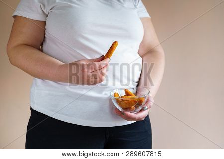 Processed Products, Fast Food, Unhealthy Diet, Imbalanced Ration. Overweight Woman Eating Breaded Fa