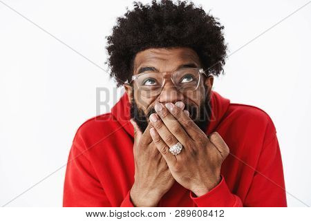 Waist-up Shot Of Delighted Happy African American Male Bearded Friend In Glasses Chuckling, Giggling
