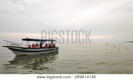 Kuala Selangor, Malaysia- 10 Mar, 2019: Tourists Enjoy The Eagles Feeding In A Boat At Kuala Selango