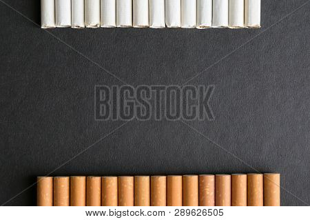 Place For Text Among Cigarettes And Tobacco, Black Background.