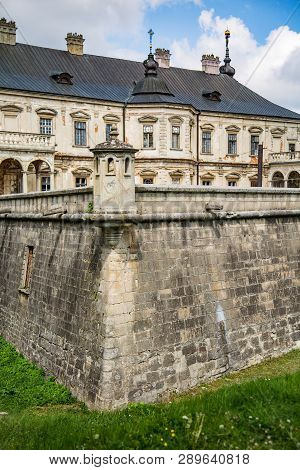 Exterior On The Podgoretsky Castle Of General Access In Ukraine In The Summer On A Clear Day With Bl