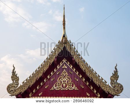 Carved Floral Pattern In The Traditional Thai Style On The Gable Of The Thai Church.(public Area Not