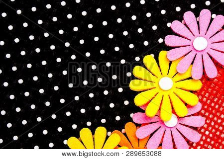 Birthday Gift Card With Red  Ribbon Decoration And Multicolor Flowers Laying On Black Dotted Backgro