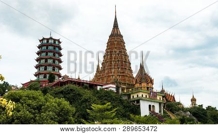 Wat Tham Suea On A Hill With Clouds In The Background