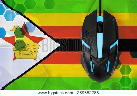 Zimbabwe Flag  And Computer Mouse. Concept Of Country Representing E-sports Team