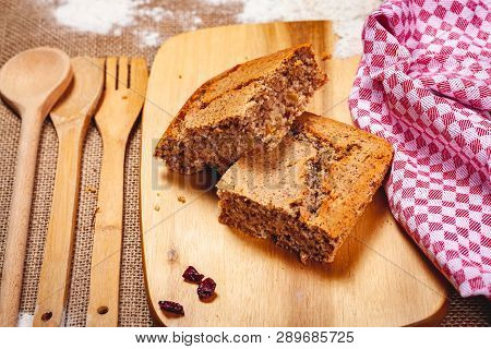 Two Slices Of Homemade Semolina Cake On Wooden Cutting Board. Close Up