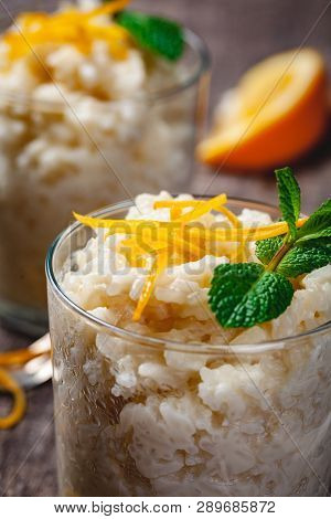 Rice Pudding In A Glass On Wooden Rustic Table. Close Up