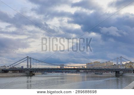 Krymsky Bridge Or Crimean Bridge  Across The Moskva River In Moscow In The Rays Of Setting Sun In Th
