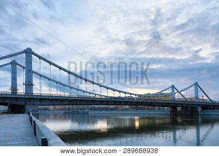 Krymsky Bridge Or Crimean Bridge  Across The Moskva River In Moscow In The Rays Of Setting Sun In Th