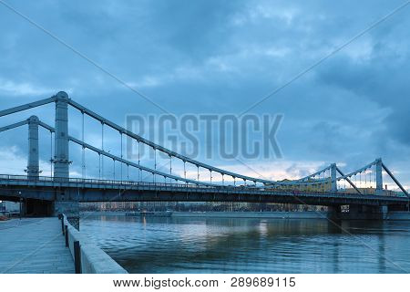 Krymsky Bridge Or Crimean Bridge  Across The Moskva River In Moscow In The Rays Of Setting Sun In Th