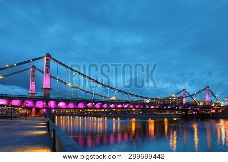 Krymsky Bridge Or Crimean Bridge  Across The Moskva River In Moscow In The Rays Of Setting Sun In Th