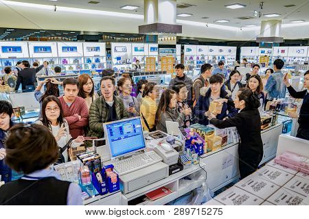 Osaka, Japan - 4 Mar 2018: Tourists And Travelers Listen And Negotiate With Sales In Duty Free Shop,