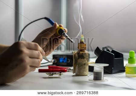Soldering Iron With Smoke From Boiling Rosin Or Colophony