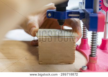 Young Male Doing Holes In Electrinic Or Silicon Plate Circuit Board