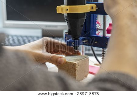Young Male Doing Holes In Electrinic Or Silicon Plate Circuit Board