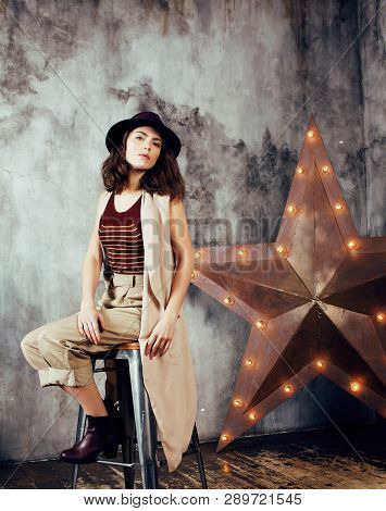 Young Pretty Woman Waiting Alone In Modern Loft Studio, Fashion Clothers Wearing Hat, Lifestyle And 