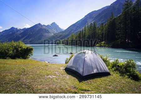 Camping Tent In The Nature. Mountains And Lake.