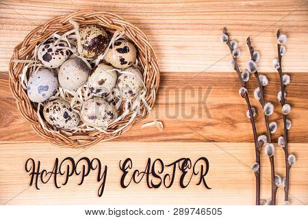 Happy Easter. Easter Background With Eggs In A Basket And Pussy-willow On Coarse Cloth
