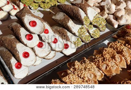 Many Desserts Called Sicilian Cannoli In Italian Language For Sale In The Street Pastry