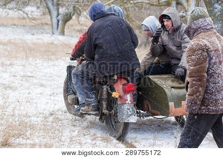 Taraclia, Moldova - 23. 02. 2019: A Team On A Soviet Retro Motorcycle With A Sidecar In The Mud And 