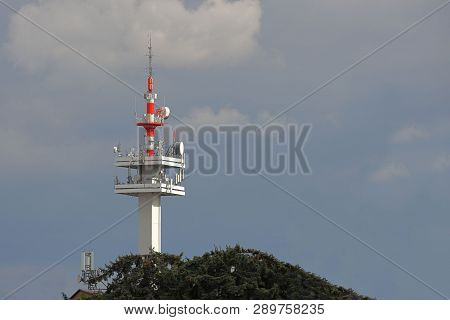 Radio Tower With Antennas On A Blue Sky Background. Metal Construction. Wireless Network. Transmit T