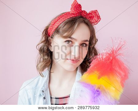 Cleaning Pin Up Woman. Smiling Pinup Girl Holds Colorful Duster Brush. Cleaning Service. Pin-up Girl