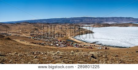 View Of Spring Landscape In Siberia With Part Of Frozen Lake Baikal In The Distance From The Top Vie