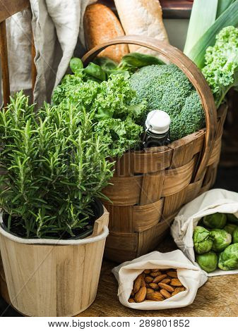 Healthy Vegetarian Ingredients For Cooking. Various Clean Vegetables, Herbs, Nut And Bread In Basket
